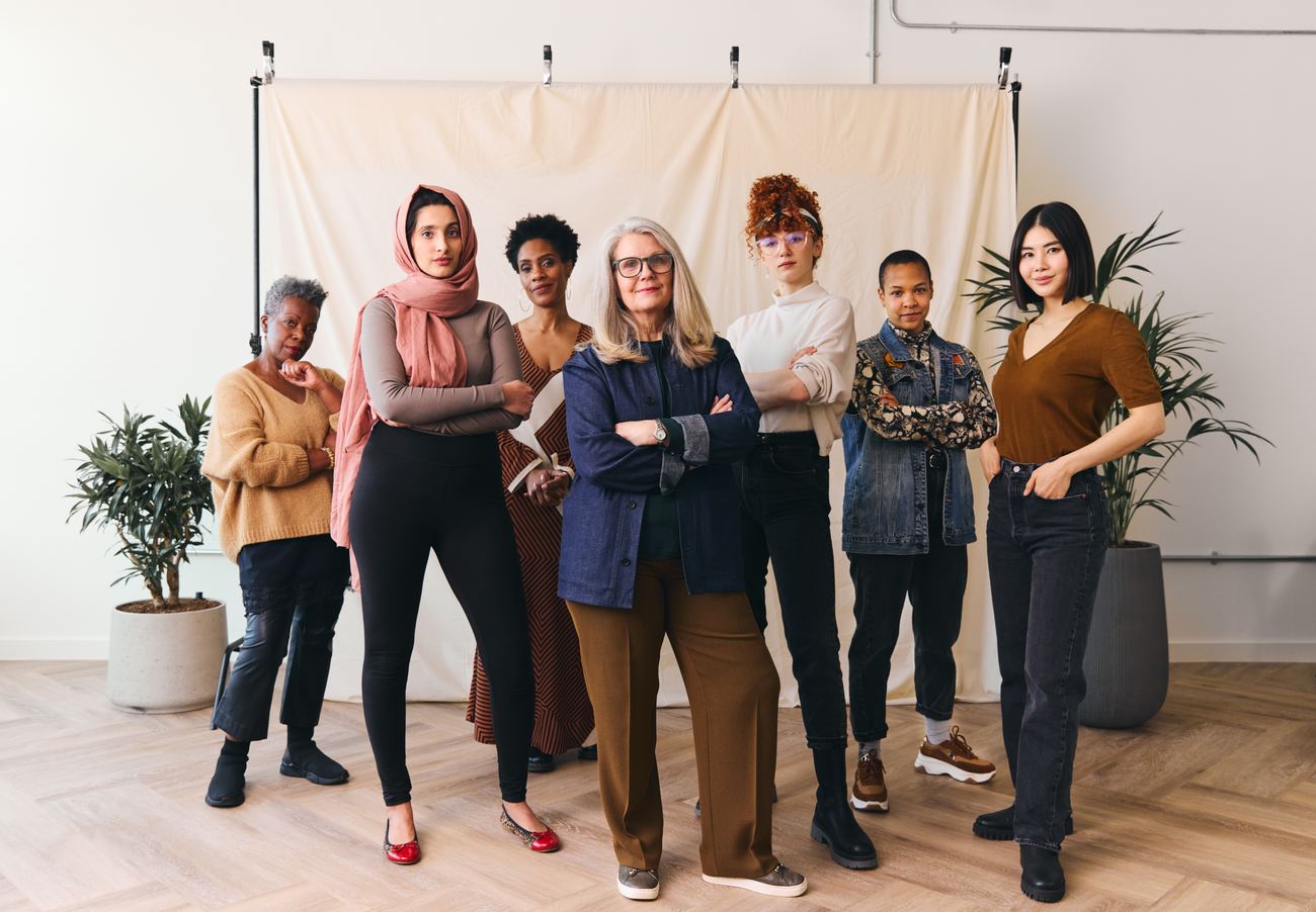 A diverse group of women standing together with quiet strength